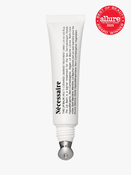 The Lip Balm in branded white tube with metal applicator on light gray background with red Allure Best of Beauty seal in the top right corner
