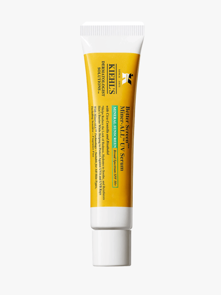 A yellow and white tube of Kiehl's Better Screen Miner-All UV Serum SPF 50+ on a light gray background