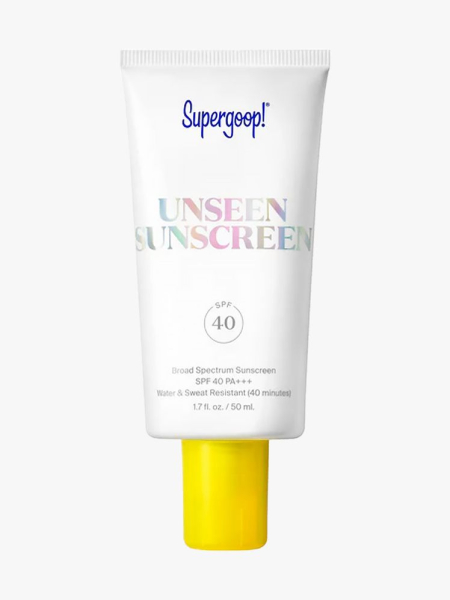 Supergoop Unseen Sunscreen in branded white tube component with yellow accents on a light gray background